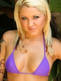 Jeska shows off her amazing body in a tiny purple bikini