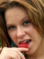 18 year old Kandie gets naked and enjoys some strawberrys in a park