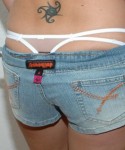 Kalees white thong is peeking out of her little jean shorts