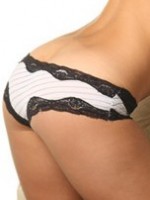 19 year old Rachel bends over to show off her tight round ass in a lace panties