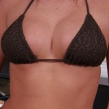 Alyssas huge perky boobs are barely covered by her tiny bikini top