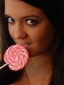 Sexy and very busty Southern Brooke shows off her oral skills on her pink lollipop