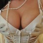 Krissys huge tits are barely contained in her white halter top