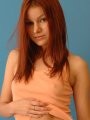 Kori nipping in her peach top